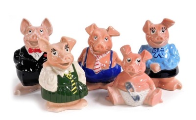 A set of five Wade Natwest bank piggy banks, raised marks.