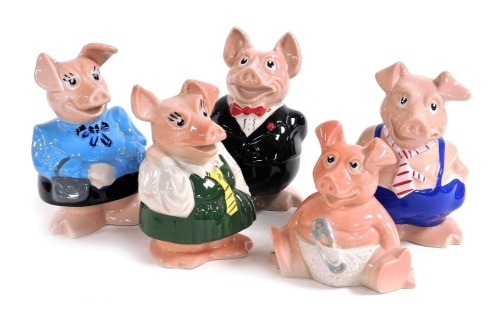 A set of five Wade Natwest bank piggy banks, raised marks.