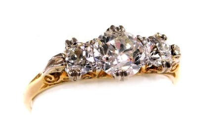 An 18ct gold and diamond three stone ring, centre diamond approximately 1.05ct, two further diamonds approximately 0.6ct, size R, 3.1g.