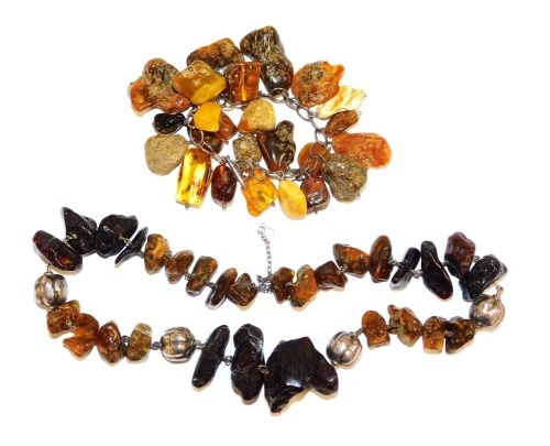 A rough hewn amber and silver necklace, together with a rough hewn and silver bracelet. (2)