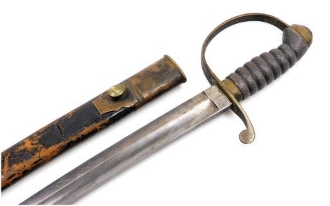 A short cavalry sword, with a shagreen grip, and brass hilt, in a leather scabbard, 74cm wide.