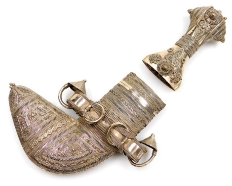 An Omani Khanjar scabbard and hilt, white metal, with filigree decoration, the scabbard blue leather backed, 6.98oz all in.