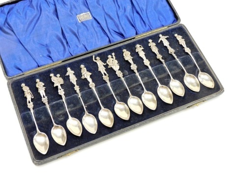 A set of twelve Continental silver coffee spoons, with orchestral figural terminals, cased, L Neresheimer and Company, London 1925, 6.00oz.