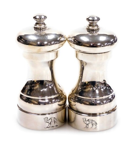 A pair of Elizabeth II loaded silver pepper grinders, crest engraved, London 1987, 8.81oz all in.