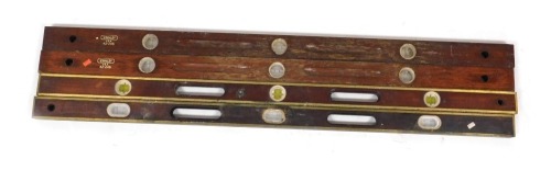 A pair of Stanley spirit levels, 42-246, 122cm wide, and a pair of brass mounted unmarked spirit levels, 122cm wide. (4)