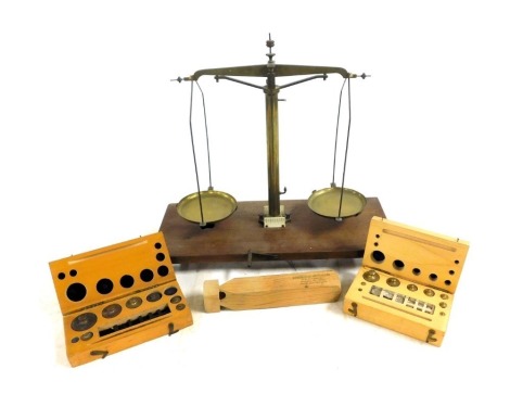 A set of brass gold scales, together with two boxes of weights, etc.