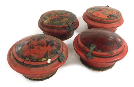 Four Chinese red lacquered wooden circular food containers, with decorated lids.