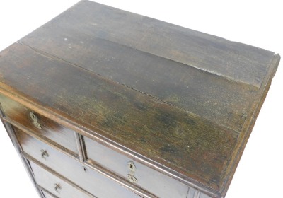 A 17thC style oak chest, of two short over three long graduated drawers, raised on block feet, 114cm high, 89cm wide, 63cm deep. - 2