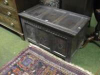 A 17thC oak 3 panel Coffer with scoop carved frieze