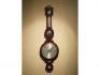 A mid 19thC mahogany cased wheel barometer