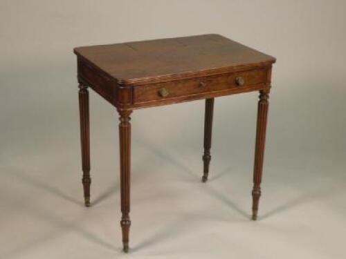 A George IV plum pudding mahogany writing table in the manner of Gillows