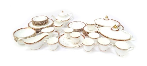 A Royal Doulton part tea and dinner service decorated in the Sandon pattern, comprising teapot, two handled sugar bowl, eight teacups and sauces, nine sandwich plates, milk jug, gravy boat and saucer, seven breakfast bowls, six side plates, ten dinner pla