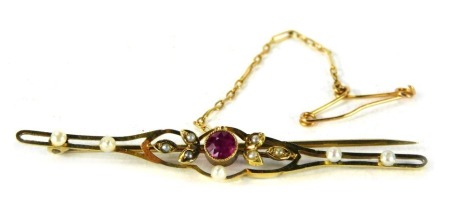 A Victorian bar brooch, set with central garnet and seed pearls on single pin back, with safety chain, 6cm wide, 3.3g all in.