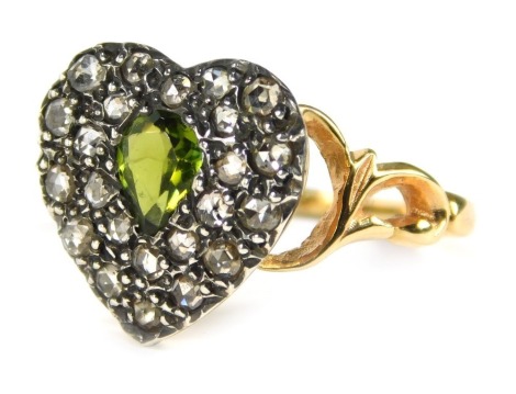 A heart shaped dress ring, the white gold heart pave set with old cut diamonds and a central teardrop citrine, with twisted scroll shoulders, yellow metal, unmarked, size O, 3g all in, boxed.