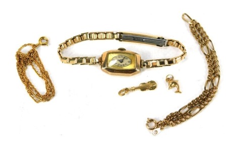 A 9ct gold cased wristwatch, of rectangular design, with silvered numeric dial and black hands, on a gold plated bracelet, 6.4g all in, two 9ct gold charms, comprising violin and dolphin, and two gold plated chairs. (5)