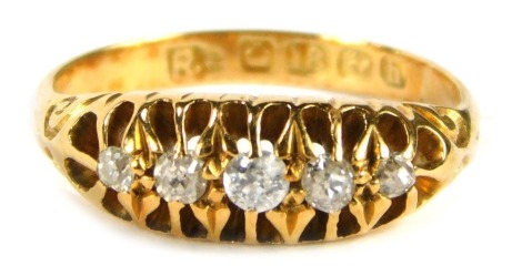 An 18ct gold diamond gypsy ring, old cut diamonds each in claw setting, with scroll design shoulders, size F, 2.7g all in.