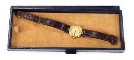 A Must de Cartier wristwatch, the faux gilt wristwatch head stamped 925, No 18 112 564, on a cream numeric dial, with blue hands, 2.5cm wide, on a brown leather strap, in Harvey Nichols box.