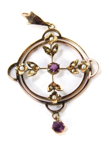 An Edwardian target pendant, set with seed pearls and amethyst, of circular design, yellow metal unmarked, 5cm high, 2.3g all in.