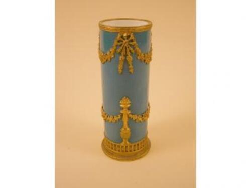 A French turquoise porcelain cylindrical vase after Sevres with gilt metal mounts