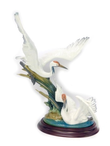 A Lladro figure group of two cranes, no. 01456, on oval base, 51cm high.