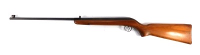 A UL air rifle, enscribed CC26201, with wooden stock, 107cm long.