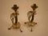 A pair of brass candlesticks