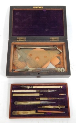 A late 19thC drawing instrument cased set, the top layer with multiple tools and a fitted and lined purple velvet interior, the brass applied plaque to the rosewood case, bearing the initials H F, 6cm high, 18cm wide, 11cm deep, together with a quantity o - 2