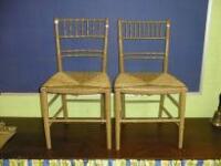 A Harlequin set of 6 Victorian painted simulated bamboo chairs with rush seats