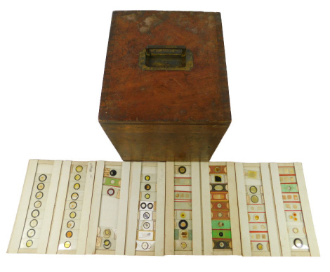 A 19thC mahogany collectors case, containing microscopic slides, flora fauna and insects, each in titled draws, 29cm high, 26cm wide, 29cm deep, and an additional cardboard box with microscopic slides, each labelled by country (2)