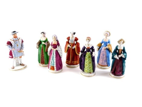 A set of seven continental porcelain figurines, Henry VIII and his six wives, printed marks in blue to underside, Henry VIII (AF) 21cm high, etc.