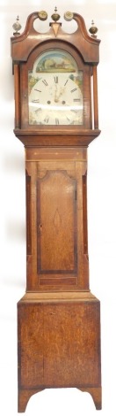 A 19thC longcase clock by W Chapman of Lincoln, the arched painted dial decorated with rural scenes of figures, buildings, etc., an eight day movement in oak and mahogany cross banded and boxed with strung case, 220cm high.