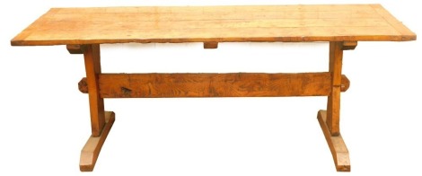 An elm and burr elm refectory table, the four planked top with cleated ends on plain end supports, constructed in part using old timber, 80cm high, 214cm long, 75cm deep.