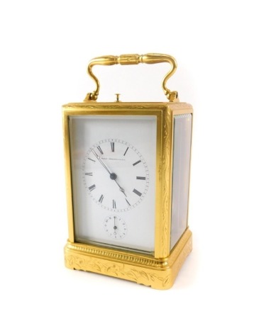 A late 19thC Japy Freres gilt brass repeating carriage clock, the white enamel dial stamped brevet d-invention S.G.D.G. the brass movement with single bell gong striking a single bell and with oval award plaque dated 1888, 18cm high.