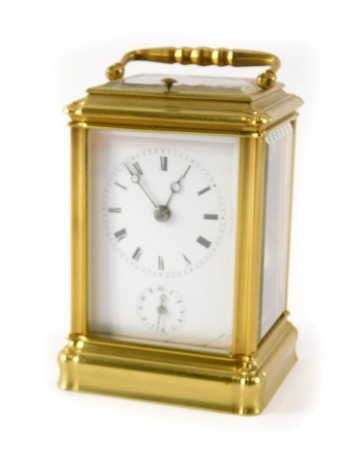 An Aiguille's brass carriage timepiece, with a white enamel Roman numeric dial, black hands, with swing handle, plate and addressed Palais Royal 52 Paris, named to back, 11cm high, 8cm wide, 6cm deep.