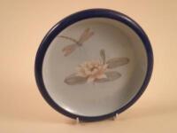 A Royal Copenhagen porcelain dish decorated with a dragonfly and a lily