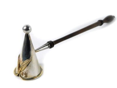 A Queen Elizabeth II silver candle snuffer by Sarah Jones, the tapering top with silver gilt decoration of crossed feathers, stamped SJ, London 1981, 24cm long.