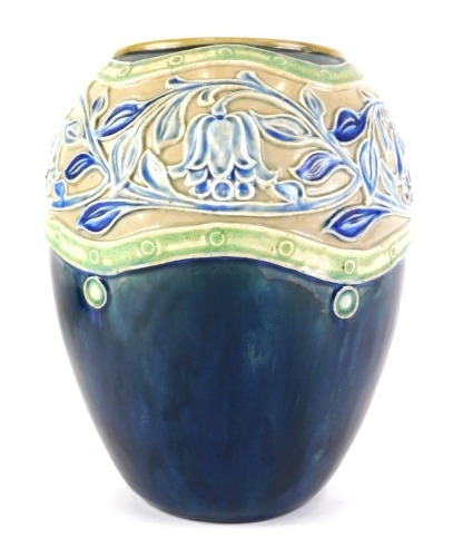 A Royal Doulton stoneware vase, with sgraffito decoration of flowers and leaves, in blue within green bands, above a mottled blue base, indistinct impressed marks to underside, 20cm high.