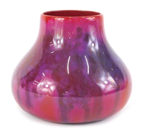 A Royal Doulton Flambe gourd shaped vase, with purple, pink and red mottled glazed, stamped to underside Royal Doulton Flambe, 10cm high.