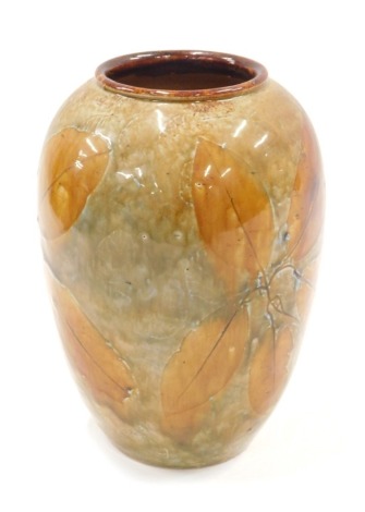 A Royal Doulton vase, on brown treacle glaze with leaf decoration, 17cm high.