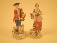 Two similar German porcelain figures of male and female musicians