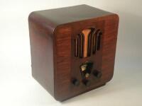 A 1934 Phillips valve radio in a walnut and Bakelite case