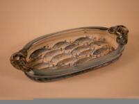 A Studio Pottery rectangular two handled dish decorated with fish by Willy Carter