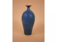 A Studio Pottery bottle shaped vase with a turquoise glaze by Stuart Walsh