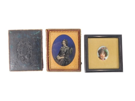 A 19thC daguerreotype photograph, of a lady in refining pose, 10cm x 7.5cm, and a continental porcelain plaque, unsigned, 3cm x 3.5cm. (2, AF)