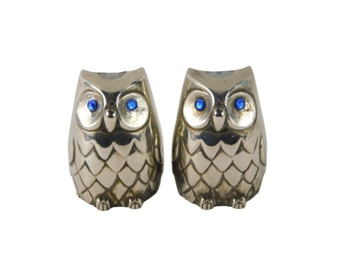 Two novelty silver plated owl salt and pepper pots, each with applied blue glass eye, 5cm high.