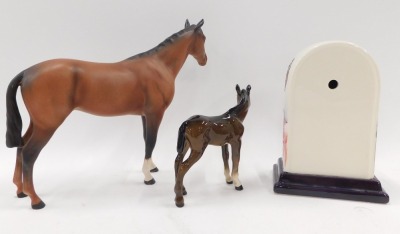 Three items of named ceramics, comprising a Royal Doulton matt glazed large horse, a Beswick foal, and an Old Tupton ware mantel clock. (3) - 2