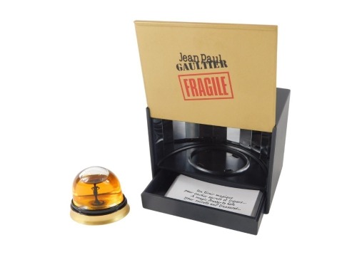 A Jean Paul Gaultier perfume snow globe, with Midnight Black lady, in presentation case, the box 9cm high, 9cm wide, 6cm deep.