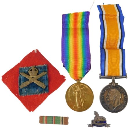 Two World War I medals, comprising The Great War for Civilisation medal, and the 14-18 George V medal, each inscribed 44184 PTE HC FLINTHAM MGC, with ribbons, a silver and enamel Egypt Lincolnshire pin badge, and a Middle Eastern crossed swords badge. (a 