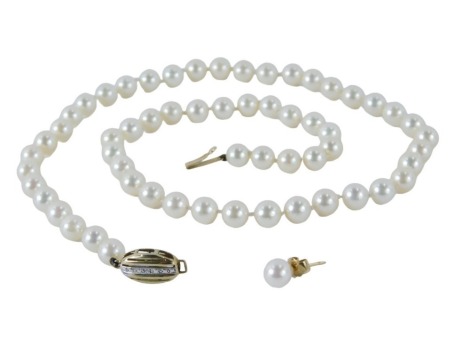 A cultured pearl single strand necklace, with an oval 9ct gold clasp, set with tiny diamonds, on knotted string strand, 46cm long, with a single 9ct gold and cultured pearl stud earring, 27.6g all in.