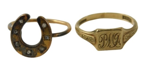 Two dress rings, comprising a 9ct gold signet ring bearing the initials PW, ring size M½, 1.9g all in, and a gold plated horse shoe dress ring. (2)